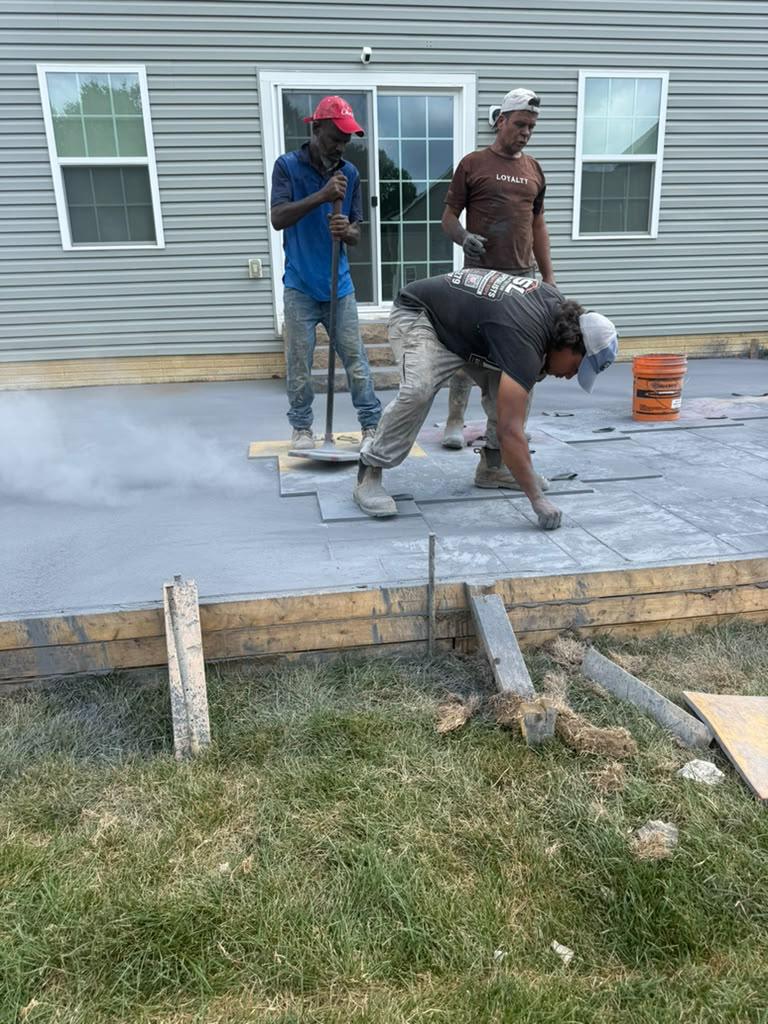 Finished concrete pool deck surface with bordered panels